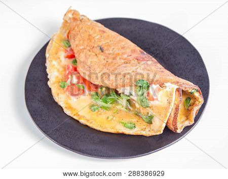 Omelette With Tomatoes And Fresh Corn Salad On A White Background