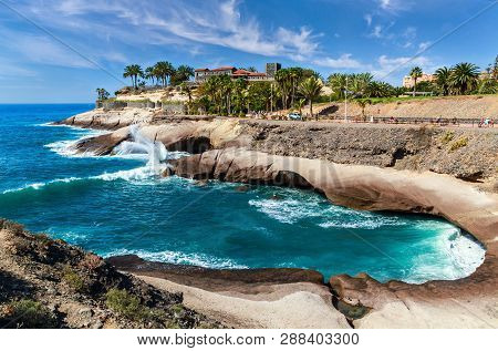 Costa Adeje, Tenerife, Spain - February 7, 2019: View Of The Rocky Cost And The Famous Casa Del Duqu