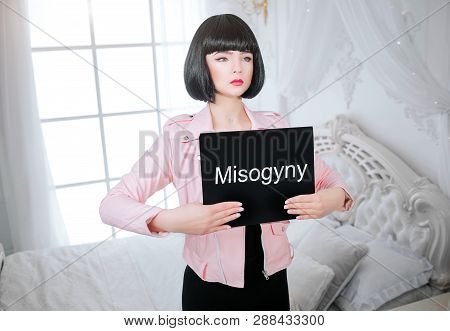 Fashion Freak. Glamour Synthetic Girl, Fake Doll With Empty Look And Short Black Hair Is Holding Pap