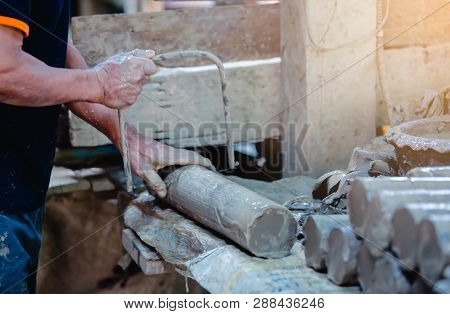 Cutting Of Cylinder Clay For Sculpting In The Workshop