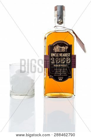 Winneconne, Wi - 7 March 2019: A Bottle Of Uncle Nearest 1856 Whiskey With A Glass Of Ice  On An Iso
