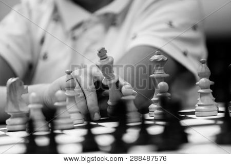Details Of The Hands Of A 12 Years Old Chess Master Playing With Chess Pieces On A Chess Board - Bla