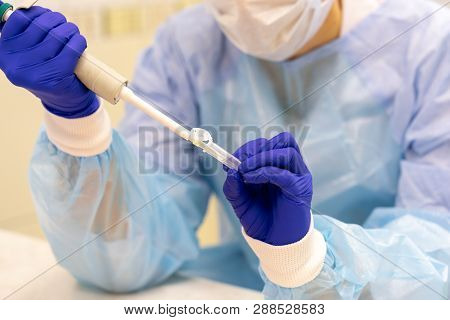 Glass And Plastic Flasks For Blood Analysis On A Stand In The Laboratory Against The Background Of A