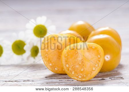 Fruit Of Cape Gooseberry, Uvilla On Wooden Background