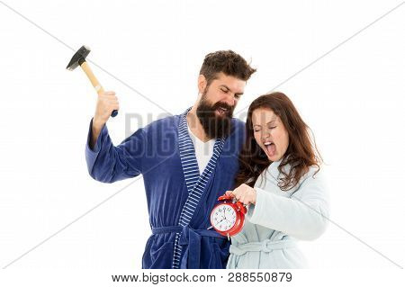 Too Much Noise. Couple Oversleep Awakening Hold Alarm Clock. Lack Of Sleep. Too Early Awakening. Ove