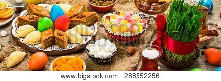 Novruz Ramadan In Azerbaijan. Colored Eggs, Wheat Springs For Easter And Traditional Sweets. Selecti