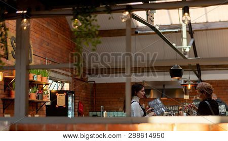 Sheffield, Uk - 9th December 2019: A White Female Makes An Order At Shed - Cutlery Works.