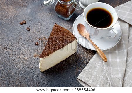 Strong Coffee In A White Cup With Sauser, Piece Of Soft Cheese Sprinkled With Ground Coffee Or Chees