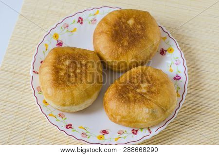 Traditional Russian Meat Pies Belyashi On A Plate.