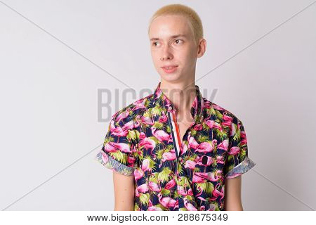 Face Of Young Happy Androgynous Tourist Man Thinking