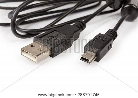 Plugs Usb Standard A And Mini-usb Standard B On Edges Of Black Cable Close-up At Shallow Depth Of Fi