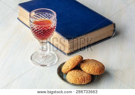 A Photo Of A Glass Of Sweet Wine With Cookies, A Book, And A Place For Text