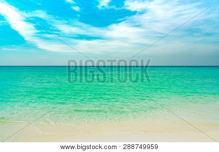 Golden Sand Beach By The Sea With Emerald Green Sea Water And Blue Sky And White Clouds. Summer Vaca