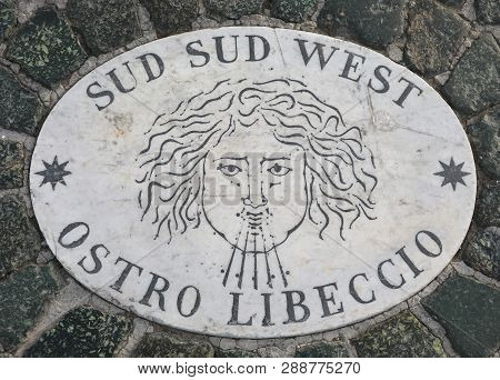 Symbol Of The Wind Called Ostro Libeccio In Italian Language With The Direction South South West Wit