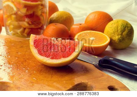 Lemons, Oranges, Tangerines, Grapefruit, Cut Into Slices And Folded Into A Jar