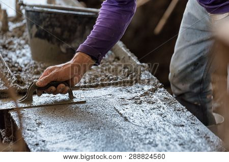 Plasterer Concrete Cement Work. Using A Trowel To Smooth Or Leveling Concrete Slab Floor Work Step O