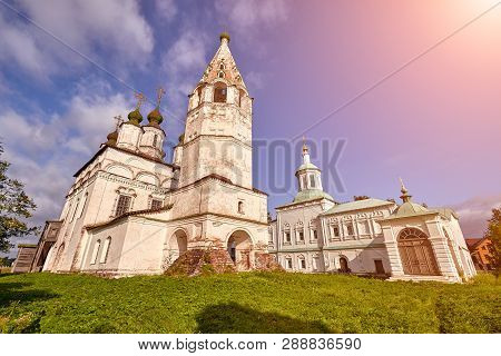 Old Orthodox Church At Village. Summer View With Floral Meadow. Sun Flare