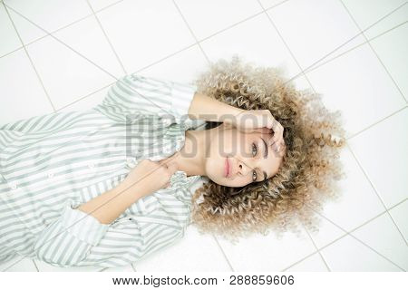 Blondegirl With Curly Hair . Beautiful Model Woman With Wavy Hairstyle.