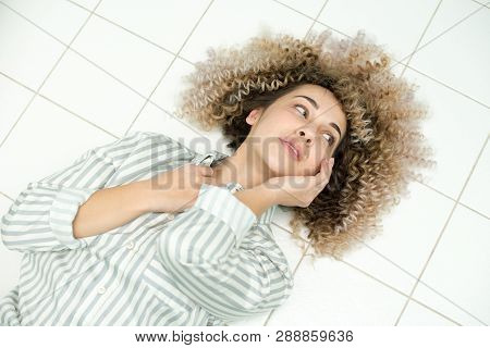 Blondegirl With Curly Hair . Beautiful Model Woman With Wavy Hairstyle.
