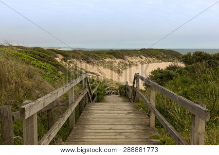 Walkway And Stairs To The Beach During Late Afternoon.
