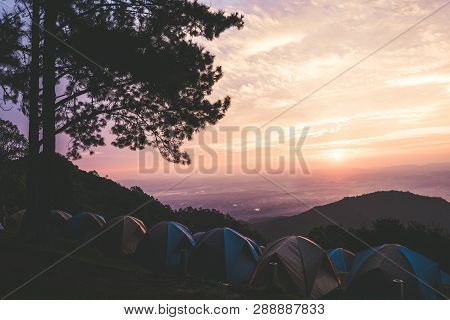 Adventures Camping Tourism And Tent ,view Forest Landscape , Outdoor In Morning And Sunset Sky At Mo