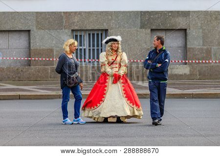 Saint Petersburg, Russia - September 10, 2017: Female Entertainer Dressed In Period Dress Approachin