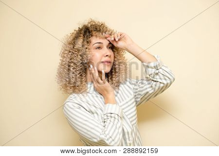 Blondegirl With Curly Hair . Beautiful Model Woman With Wavy Hairstyle.