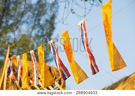 The Flag Of The Buddhist Flags And Kingdom Of Thailand Flags On Blue Sky Background In The Evening W