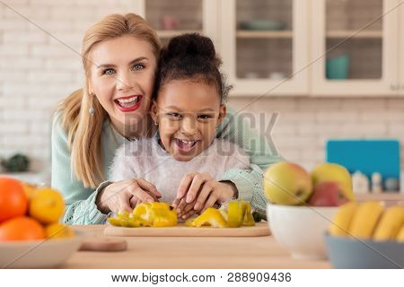 Foster Mother Feeling Happy Cooking Together With Her Girl
