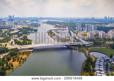 Seri Wawasan Bridge Or Putra Bridge And Putrajaya Lake With Blue Sky. The Most Famous Tourist Attrac