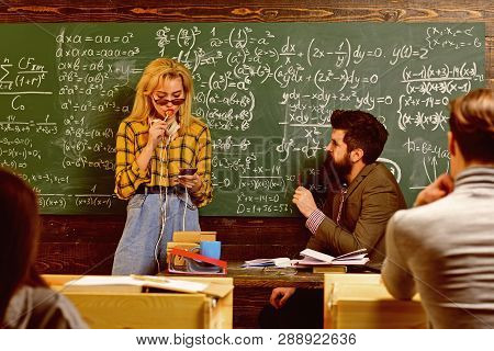 Happy University Students Studying With Books In Library. Student Is Aware That He Is An Important P
