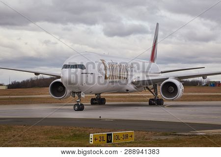 BUDAPEST, HUNGARY - DECEMBER 1, 2016: Airliner of Emirates taxiing at Budapest Liszt Ferenc Airport. Being 777-300.