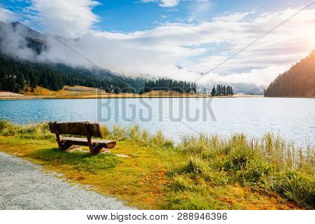 Awesome alpine lake Champfer in beautiful summer day. Location place Silvaplana village, Swiss alps, district of Maloja, Europe. Scenic image of famous european resort. Discover the beauty of earth.