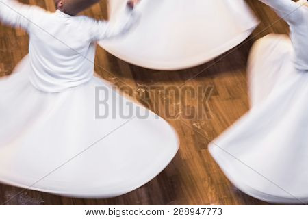 Unidentified whirling Dervishes or Semazen in Konya, Turkey