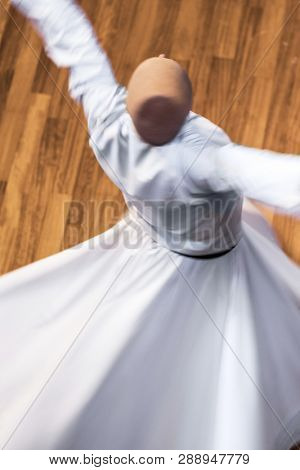 Unidentified whirling Dervishes or Semazen in Konya, Turkey