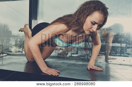 Young Sporty Girl Warming Up And Doing Some Push Ups
