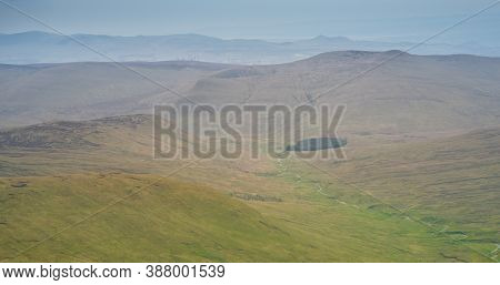 A Wild Stream Between Mountains Brings Life To Nearby Meadow - Unspioled Scottish Landscape