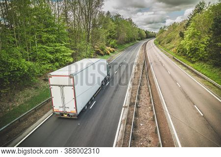 A Truck On A Dual Carriageway - No Cars On Motorway But One Lorry