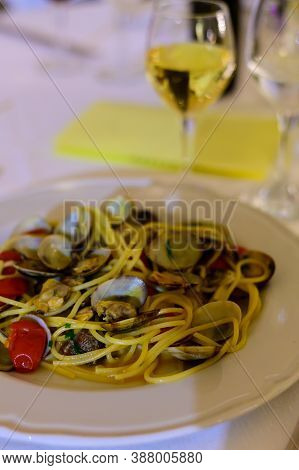 Frech Homemade Spaghetti Pasta With Vongole Sea Sheels And Small Red Tomatoes