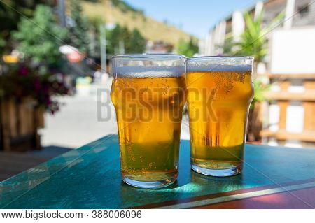 French Cold Beer In Misted Glasses Served On Outdoor Terrace In Small Alpine Village In France
