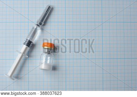 Syringe With Glucagon On A Blue Background