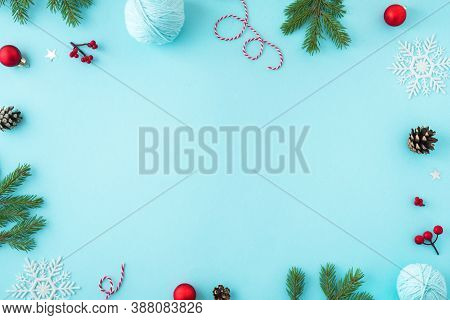 Christmas Composition. Christmas Decor, Pine Cones, Fir Branches And Showflakes On Blue Background. 