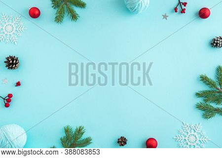 Christmas Composition. Christmas Decor, Pine Cones, Fir Branches And Showflakes On Blue Background. 