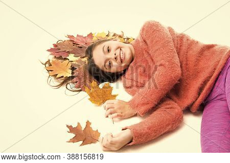 Child Enjoy Fall Season. Girl Cute Kid Long Hair Lay On White Background With Fallen Leaves. Dry Map