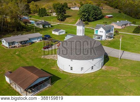Mannington Wv - 3 October 2020: Aerial View Of Well Preserved White Wooden Round Barn With Cupola In