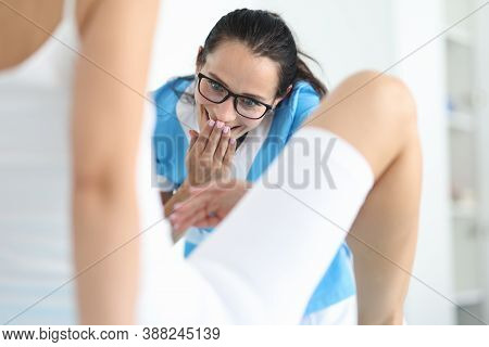 Woman Gynecologist In Glasses Examines Patient In Clinic Office With Surprise Portrait. Removal Of F