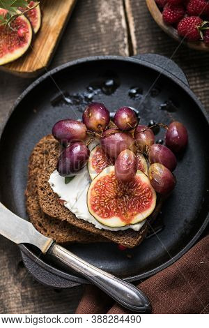 Tasty Tapas, Snack Or Crostini Or Bruschetta With Toasted Bread, Cheese, Figs. Delicious Breakfast, 