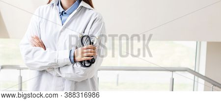 Portrait An Unknown Young Female Doctor Holding A Stethoscope