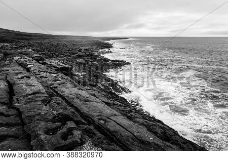 Black And White Seascape Of Irish Cliffs Battered By Waves, Ireland