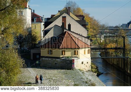 Regensburg, Bavaria, Germany - 11/11/2014: Danube River. Houses On Naberzhnaya. The Stone Bridge Is